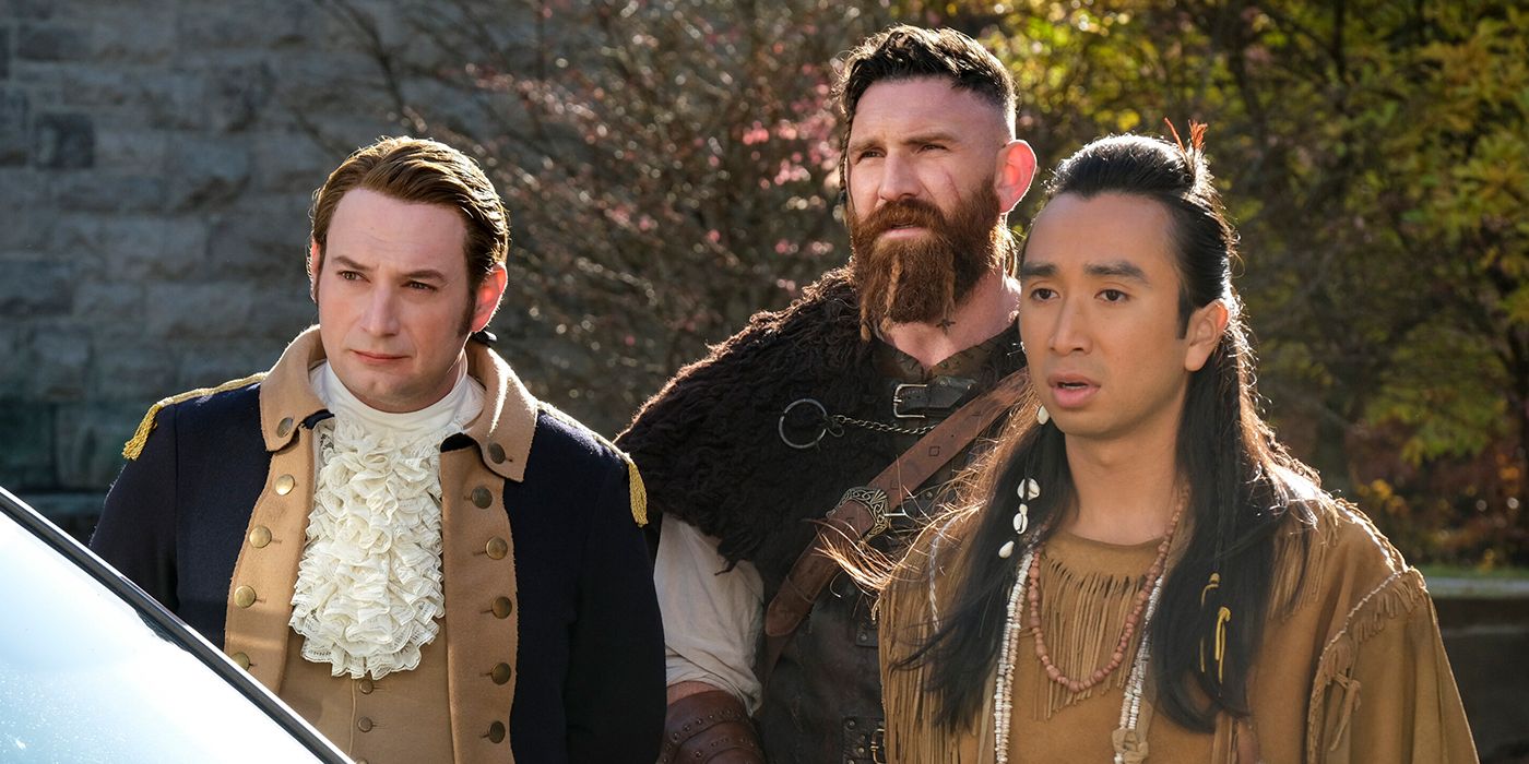 A Revolutionary solider, viking and Native American spirit look on in awe in a scene from Ghosts