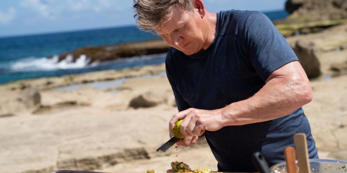 Gordon Ramsay cooking on a beach.