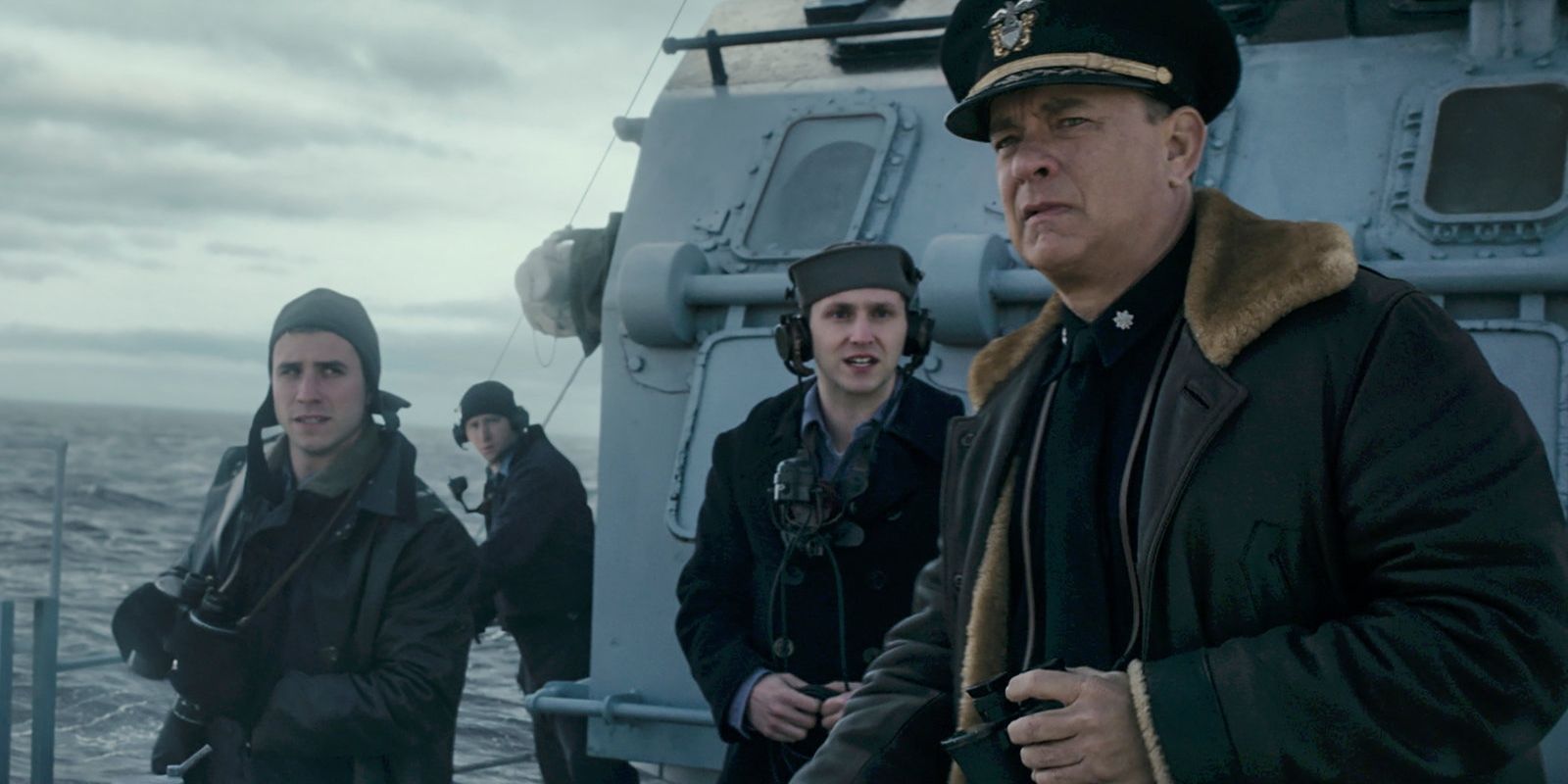 Commander Ernie Krause (Tom Hanks) with three sailors in Greyhound