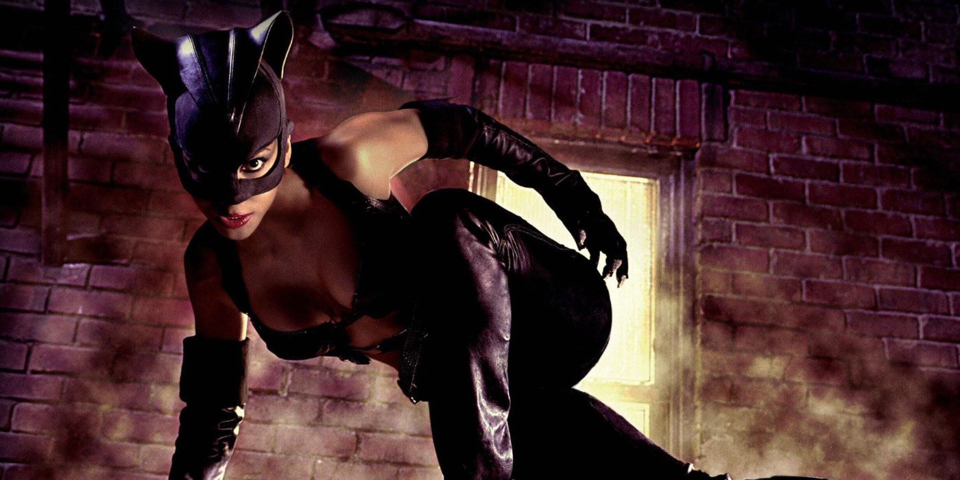 Halle Berry as Catwoman, posed on a fire escape for a promotional photo for Catwoman