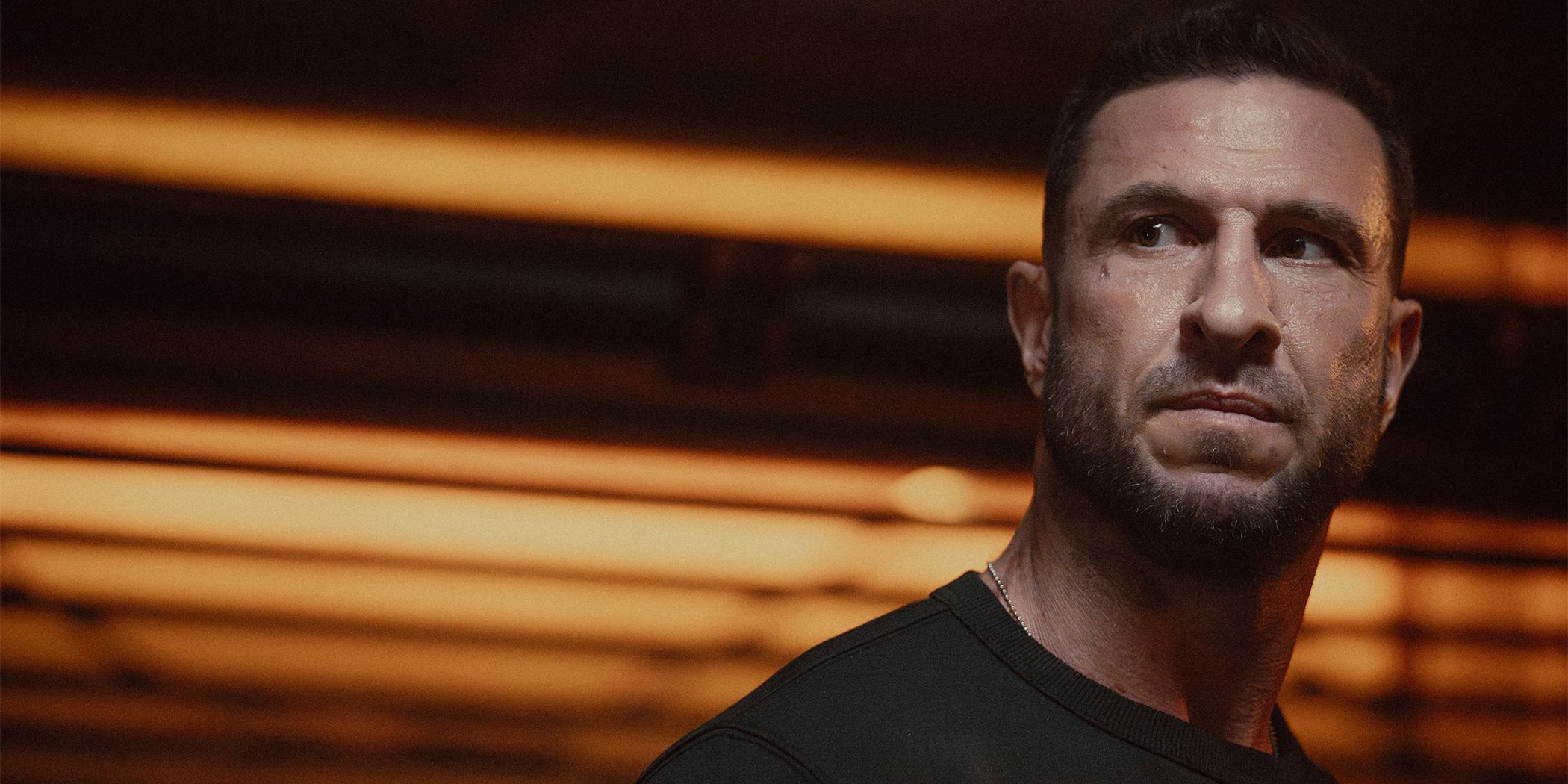 Pablo Schreiber as John-117 looking angrily over his shoulder in Halo Season 2
