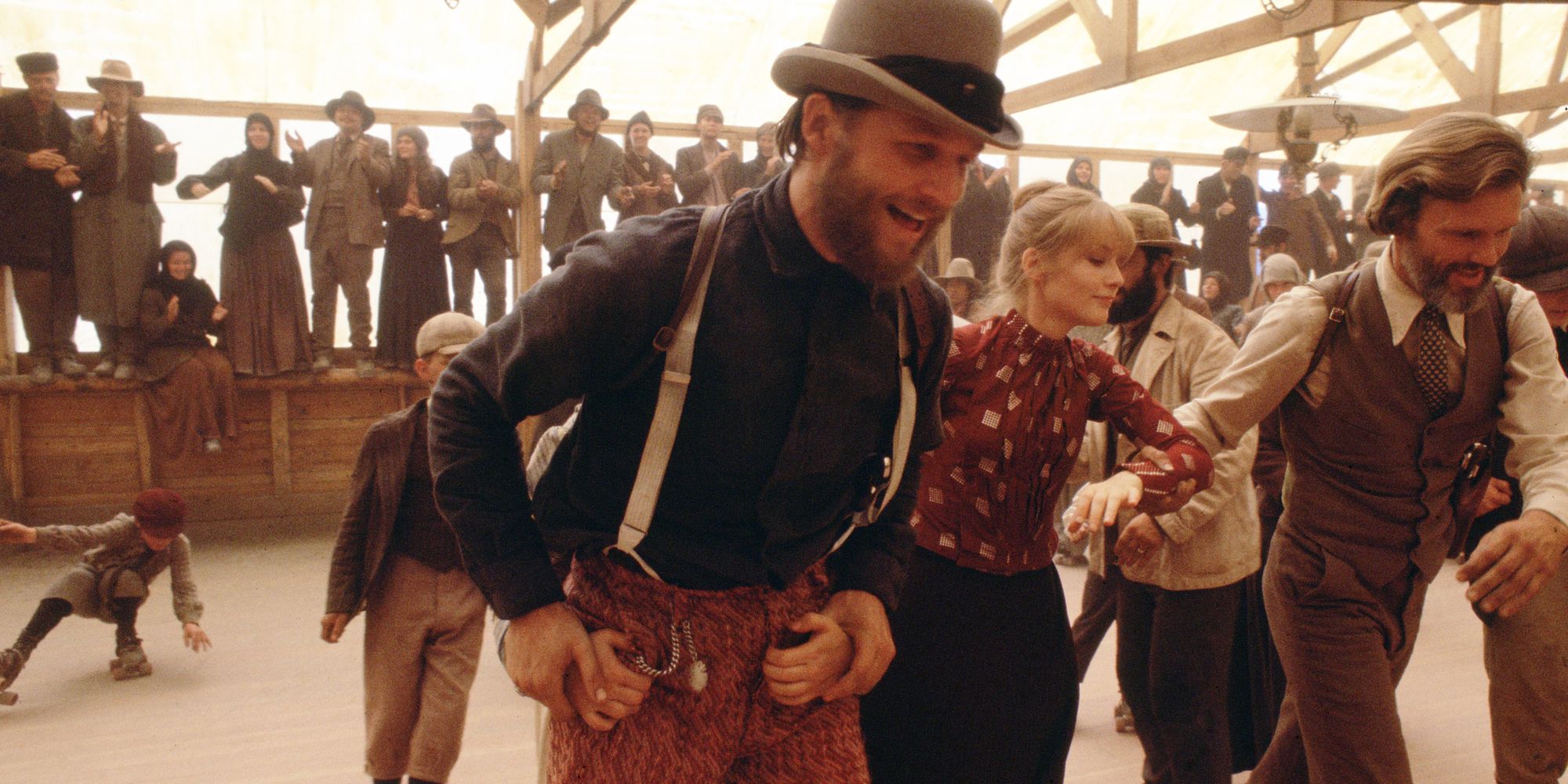 A group of people dancing at a party in Heaven's Gate 1980