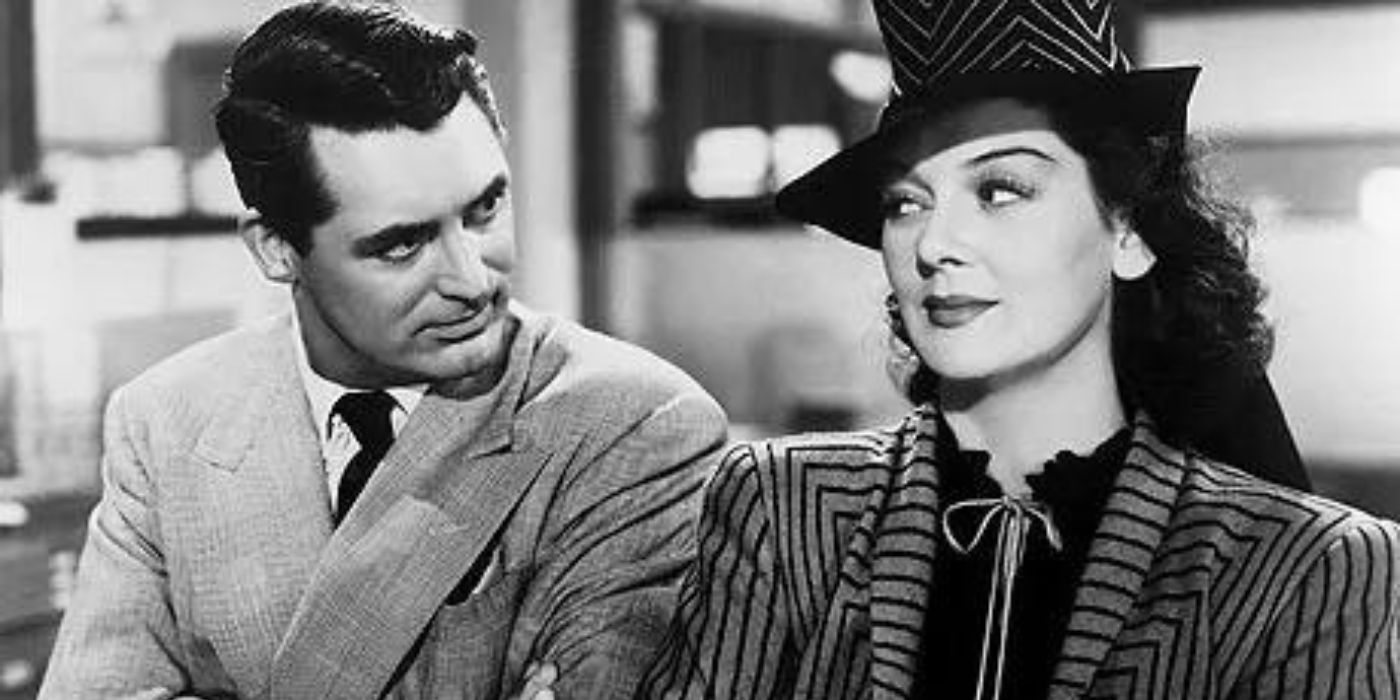 Cary Grant and Rosalind Russell looking at each other with slight smiles in His Girl Friday