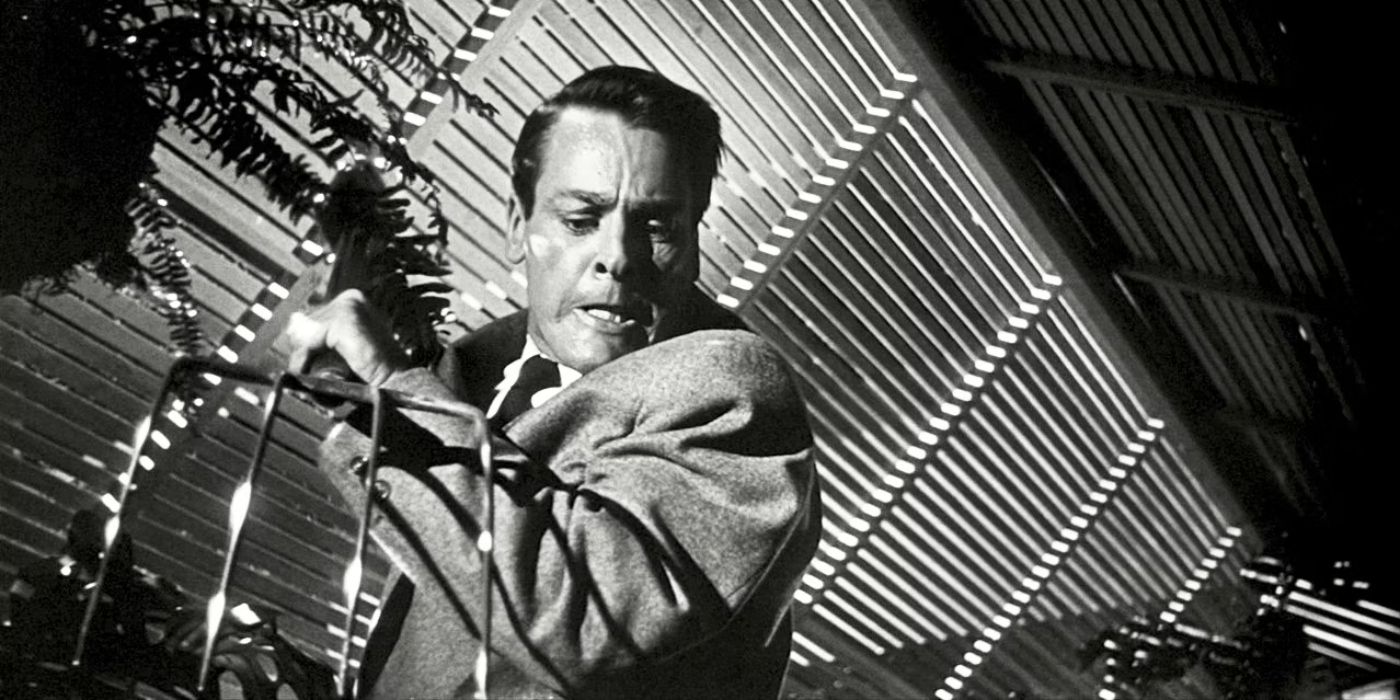 Kevin McCarthy as Dr. Miles J. Bennell, killing a pod with a pitchfork in Invasion of the Body Snatchers