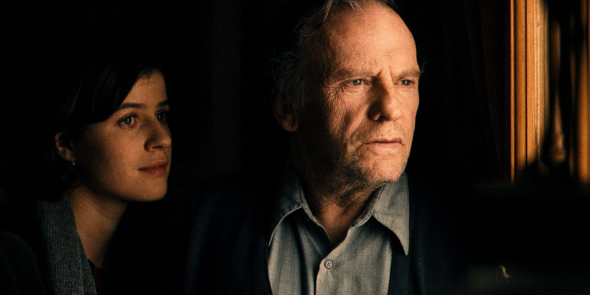 Irène Jacob and Jean-Louis Trintignant in Three Colors Red looking out of the window.