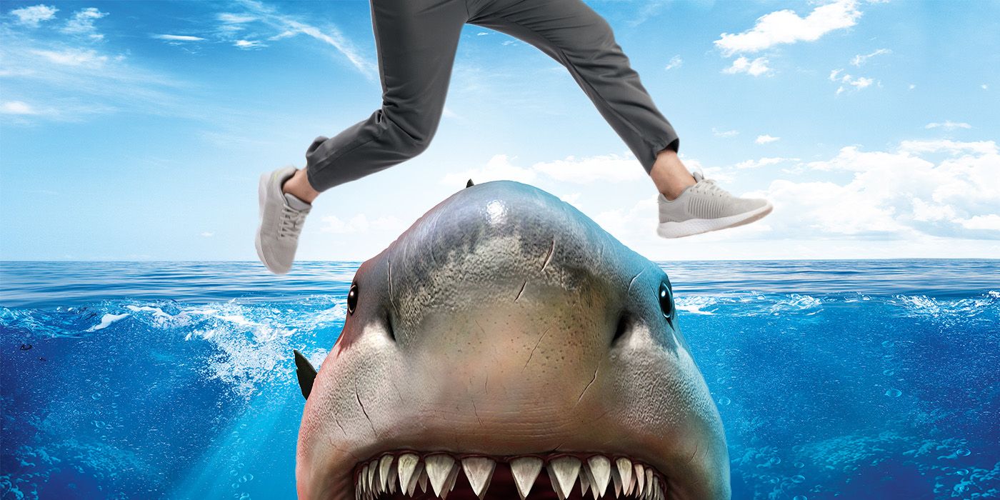 A set of feet jumping over a shark