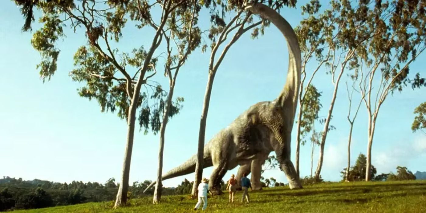 The characters of Jurassic Park marvel at a brachiosaurus.