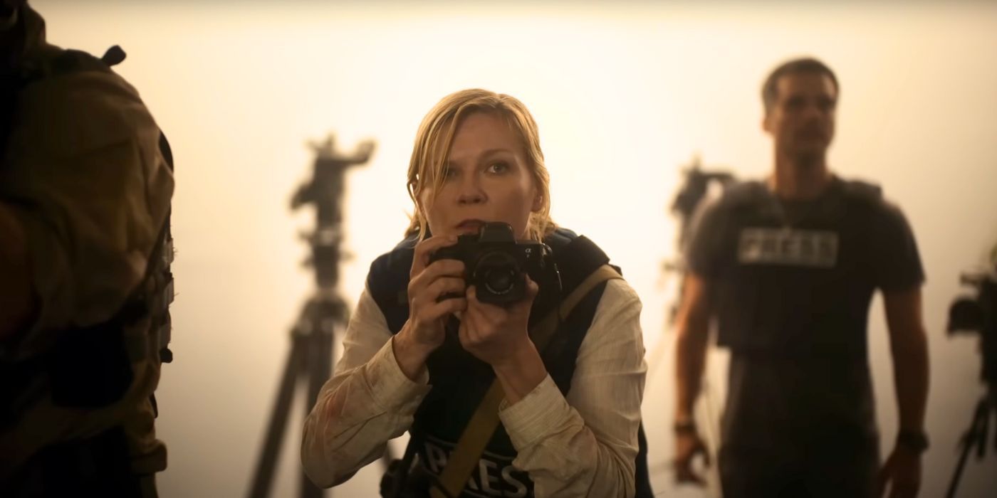 Kirsten Dunst holding up a camera in Civil War