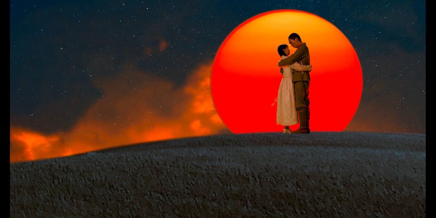 A Japanese soldier and his lover embrace as a bright orange sun rises behind them.