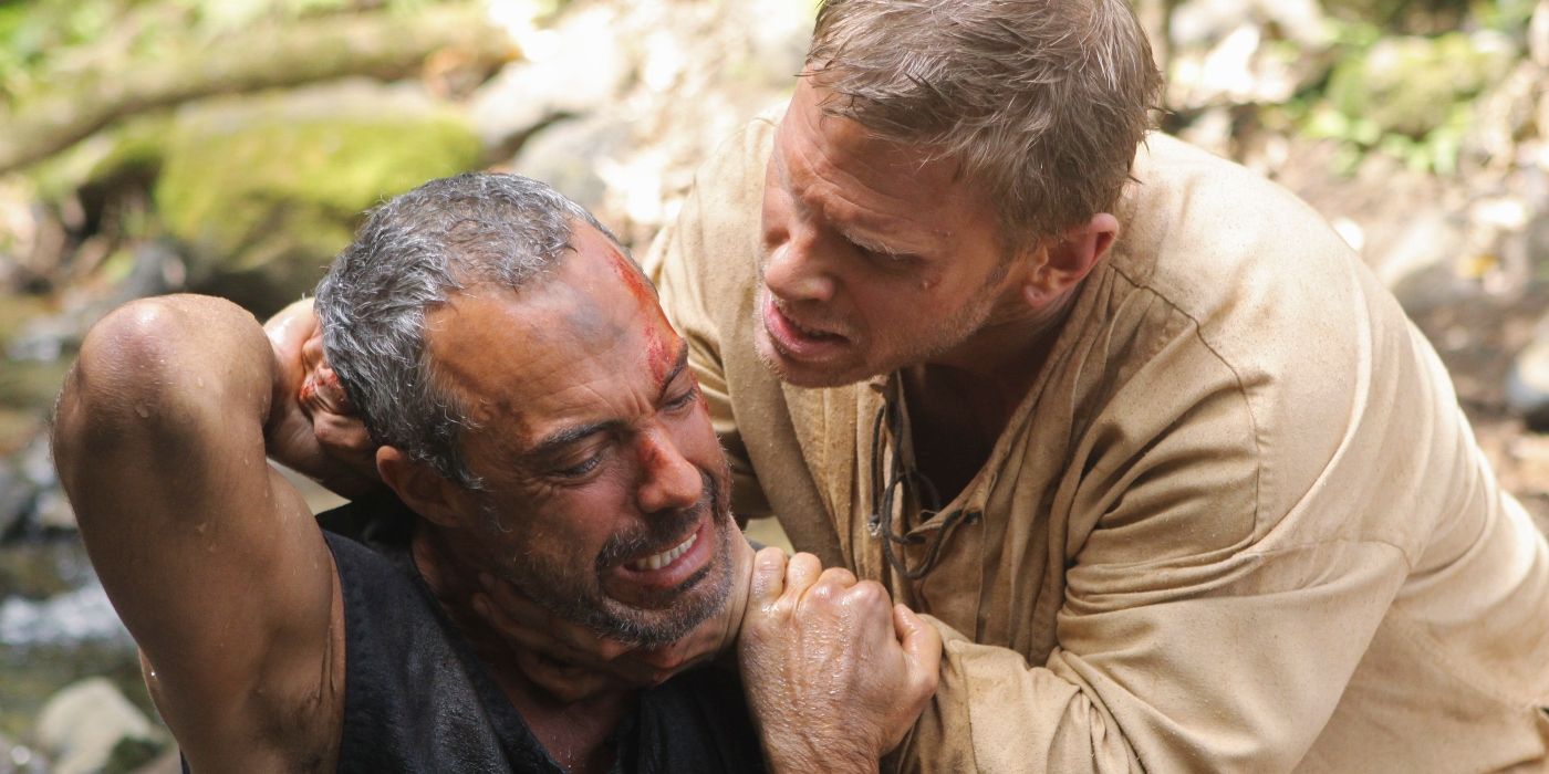 Jacob (Mark Pellegrino) and choking The Man in Black (Titus Welliver), who looks afraid, in Season 6 of Lost