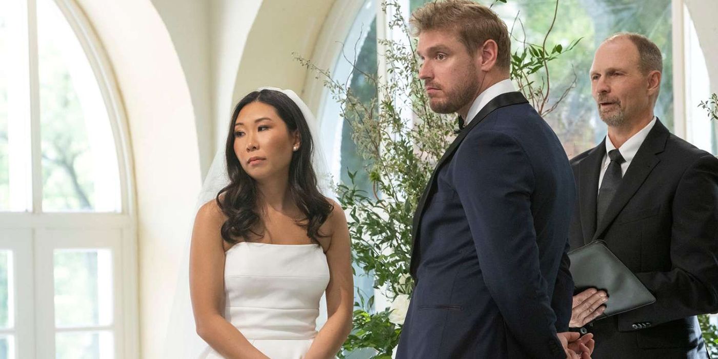 Natalie and Shayne at the altar both looking at their guests and seeming sad in Love is Blind.