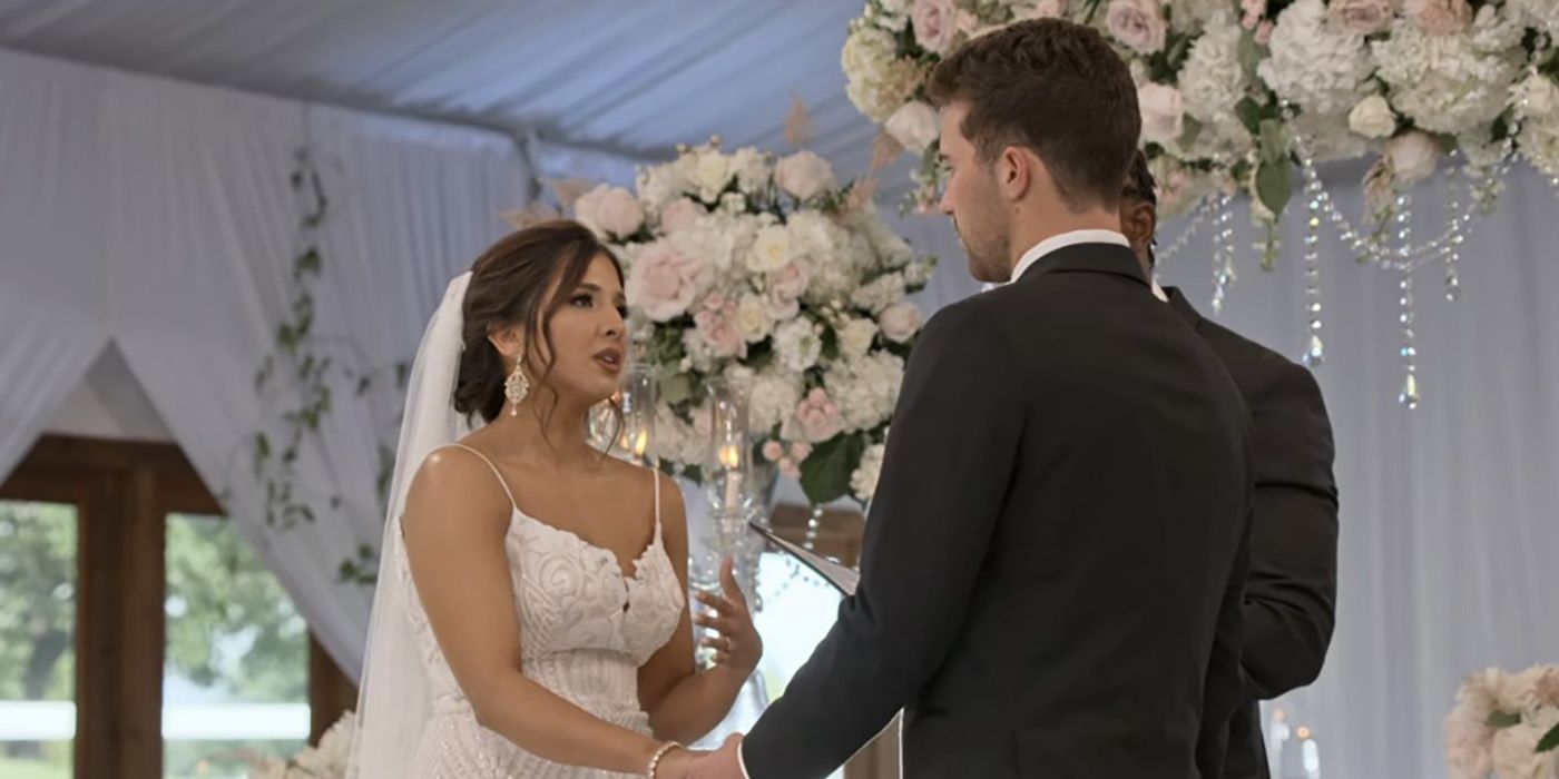 Zanab holding Cole's hand at the altar in a scene from Love is Blind.