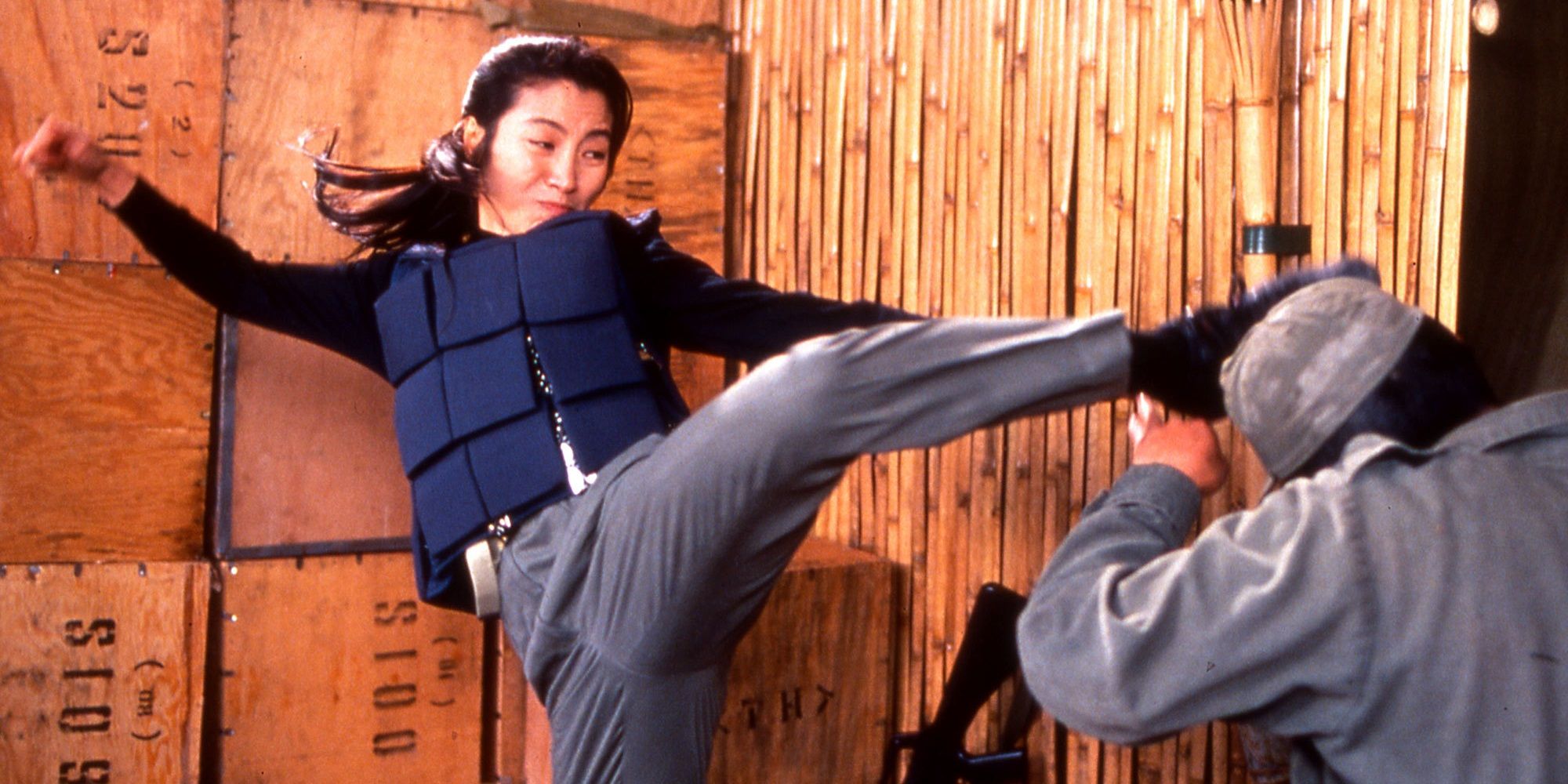 Michelle Yeoh kicking an assailant in Police Story 3: Supercop