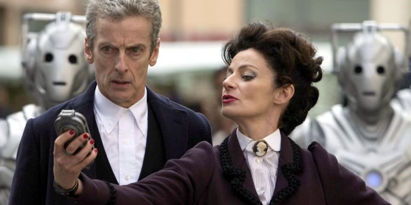 Missy shows the Doctor something in front of a line of Cybermen in 'Doctor Who'