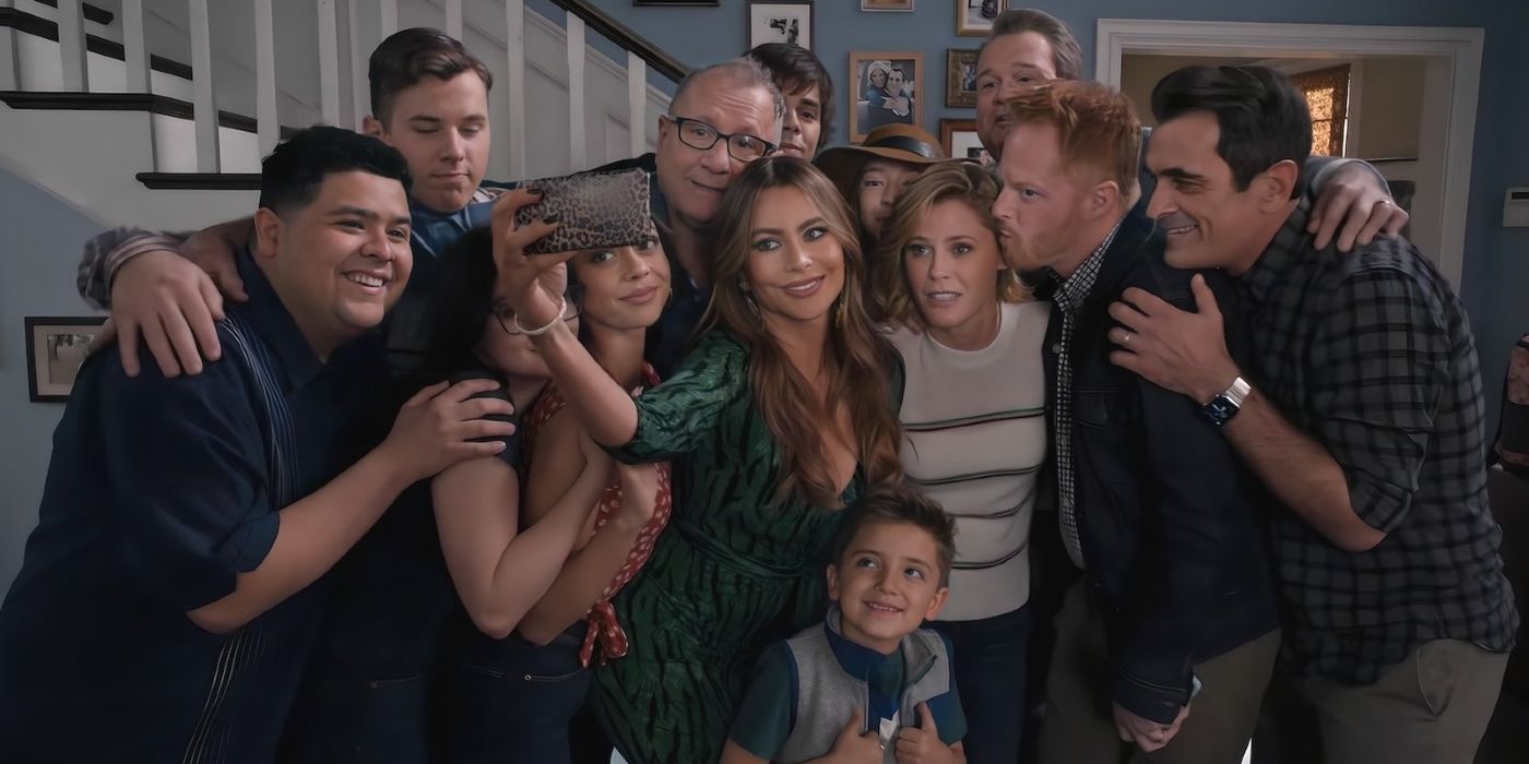 The main characters from Modern Family embracing.
