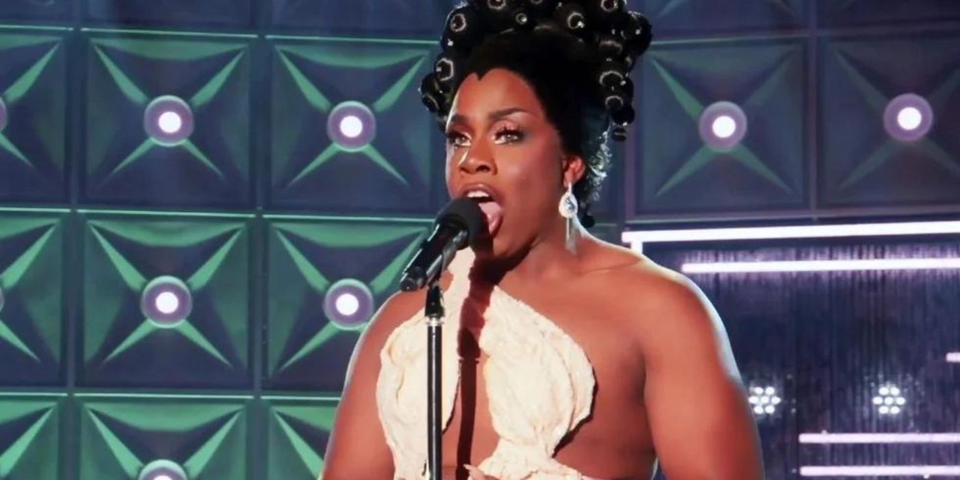 Monet X Change sings into a microphone on 'Drag Race All Stars 7.'