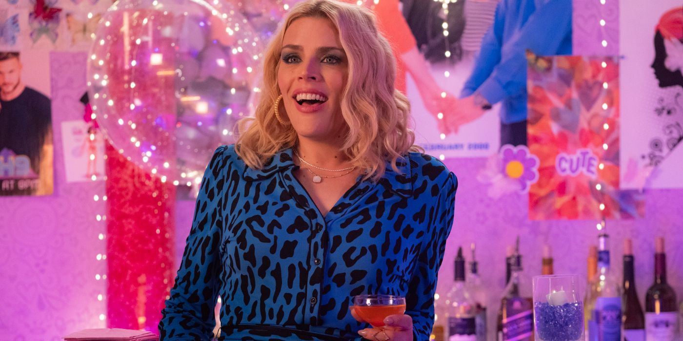 Busy Philipps wears a blue leopard print shirt and holds a cocktail in 'Girls5Eva'