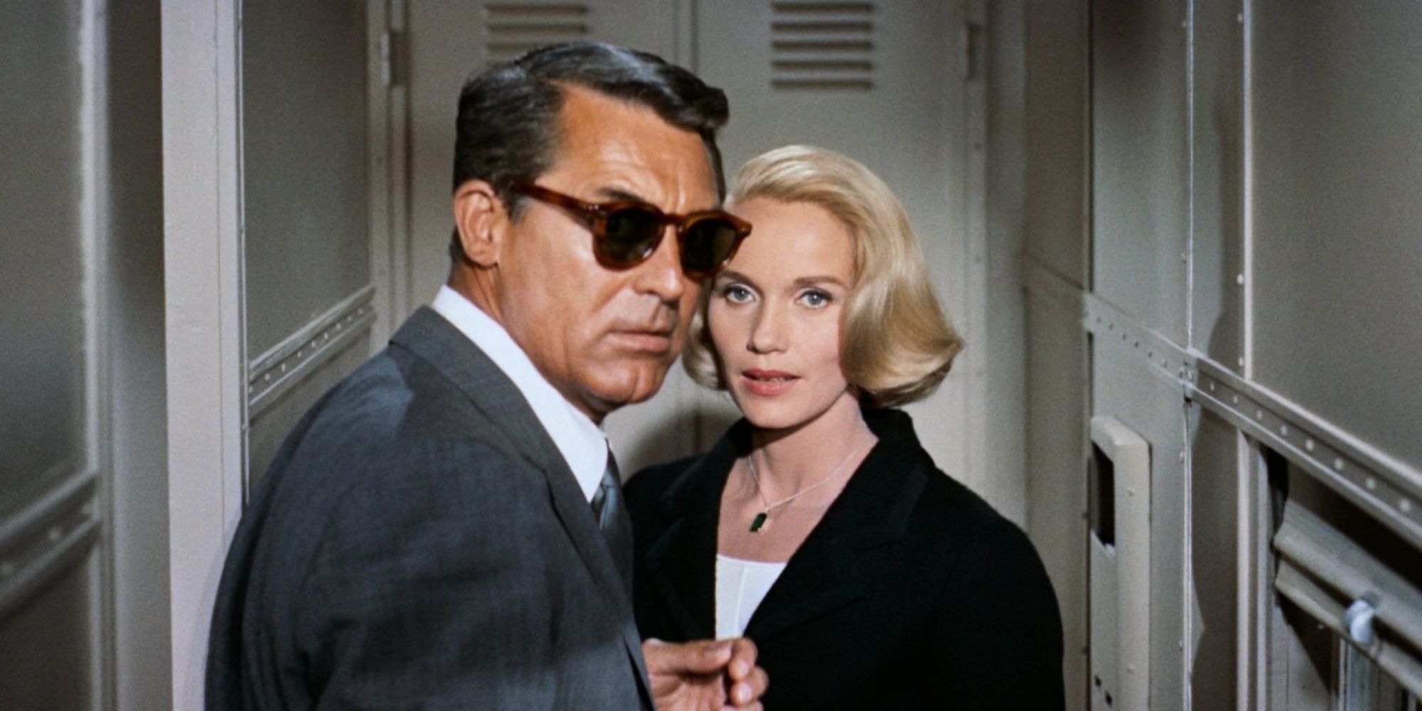 Cary Grant and Eve Marie Saint as Roger and Eve staring towards the camera