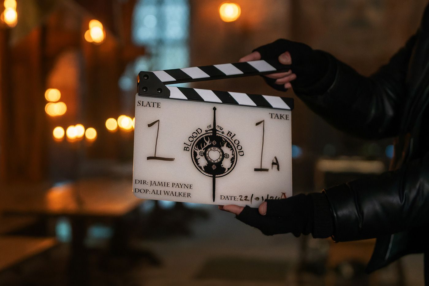 'Outlander: Blood of My Blood' set image shows the clapperboard of the series.