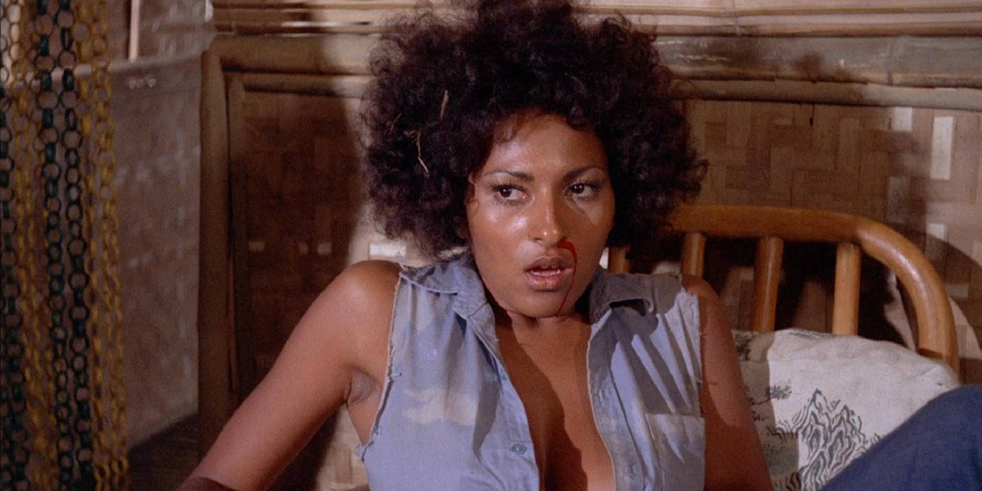 Pam Grier with a bloody nose in The Big Bird Cage.