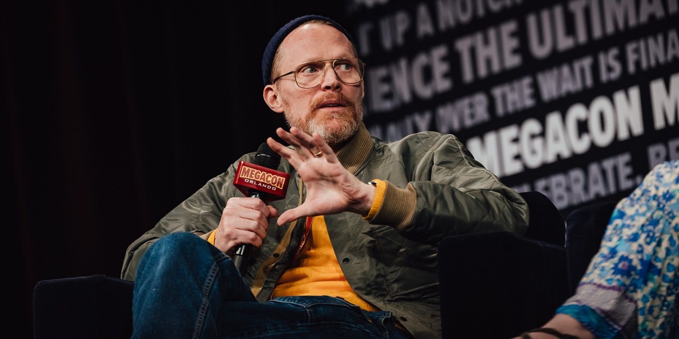Paul Bettany holding a mic while speaking at a panel during MegaCon 2024