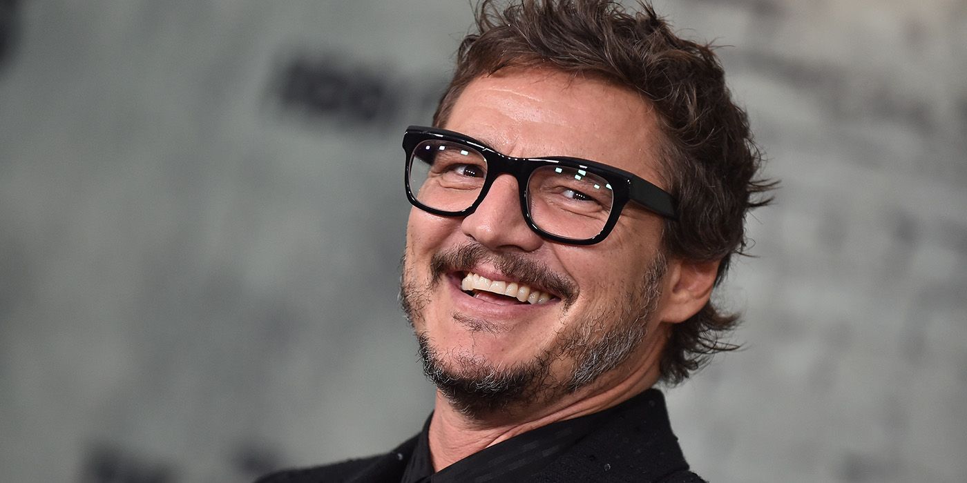 Pedro Pascal smiling on the red carpet