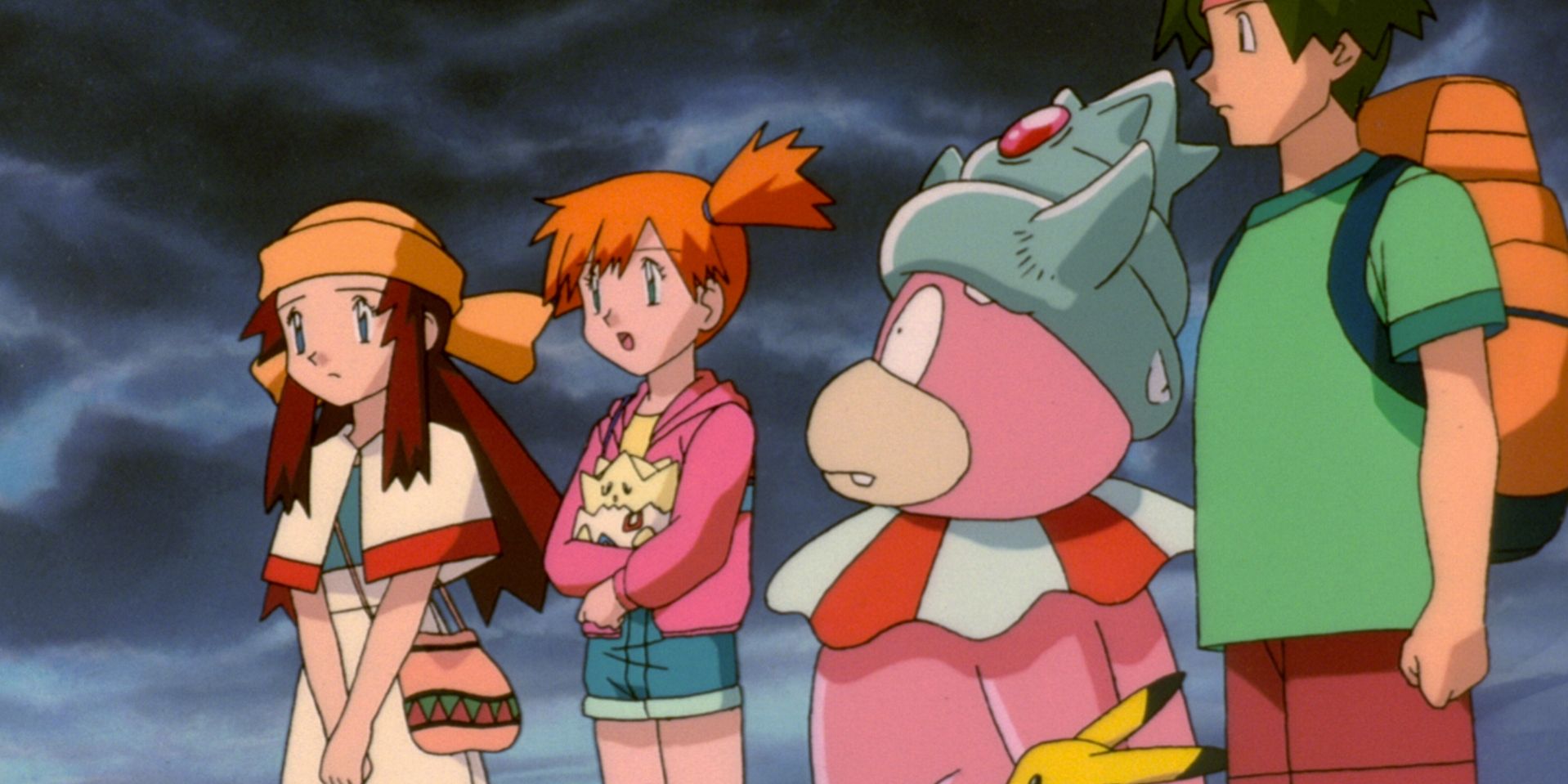 A still from Pokemon: The Movie 2000 featuring Misty and Tracey alongside a Slowking