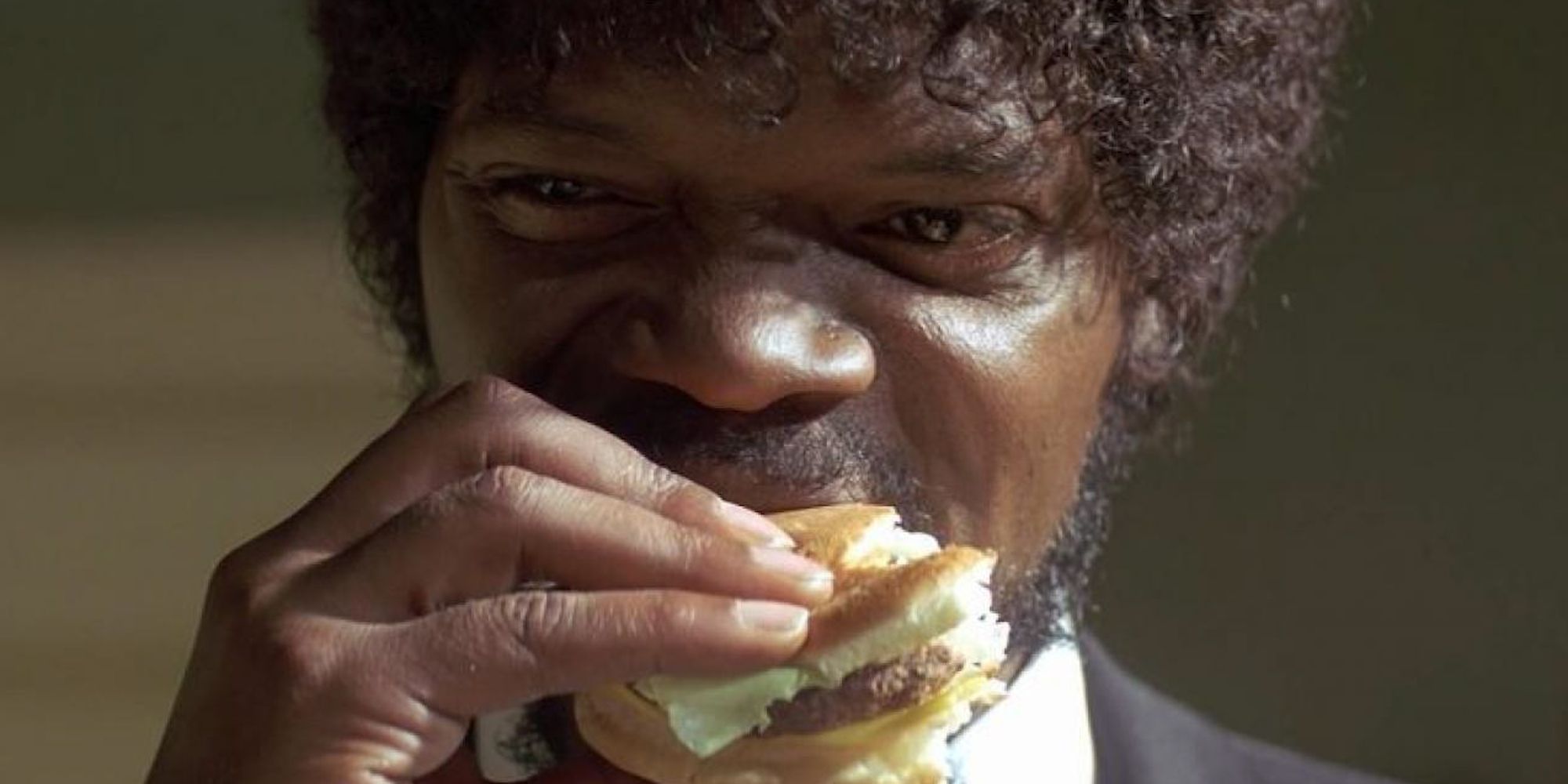 Jules eating a Big Kahuna burger in Pulp Fiction