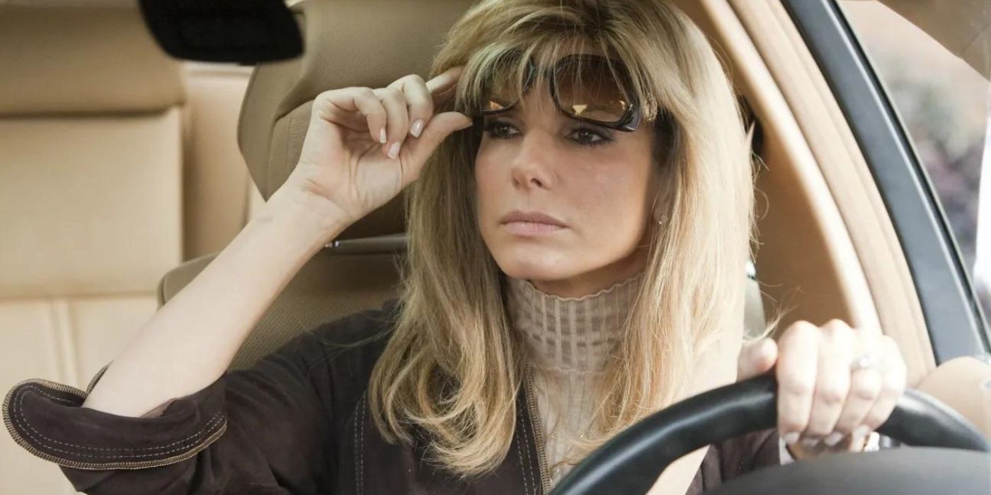 Leigh Anne Tuohy looking at her rear view mirror while inside a car in The Blind Side