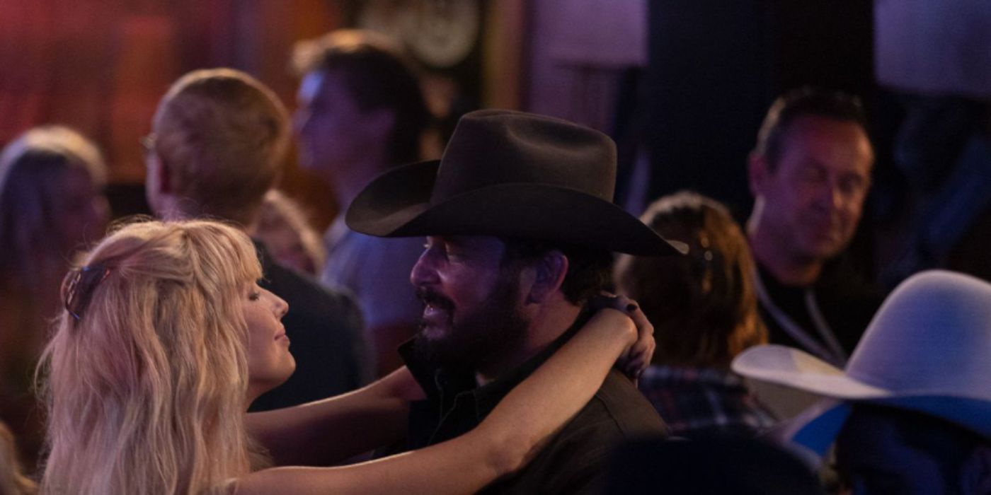 Kelly Reilly and Cole Hauser as Beth Dutton and Rip Wheeler dancing in a bar in 'Yellowstone'