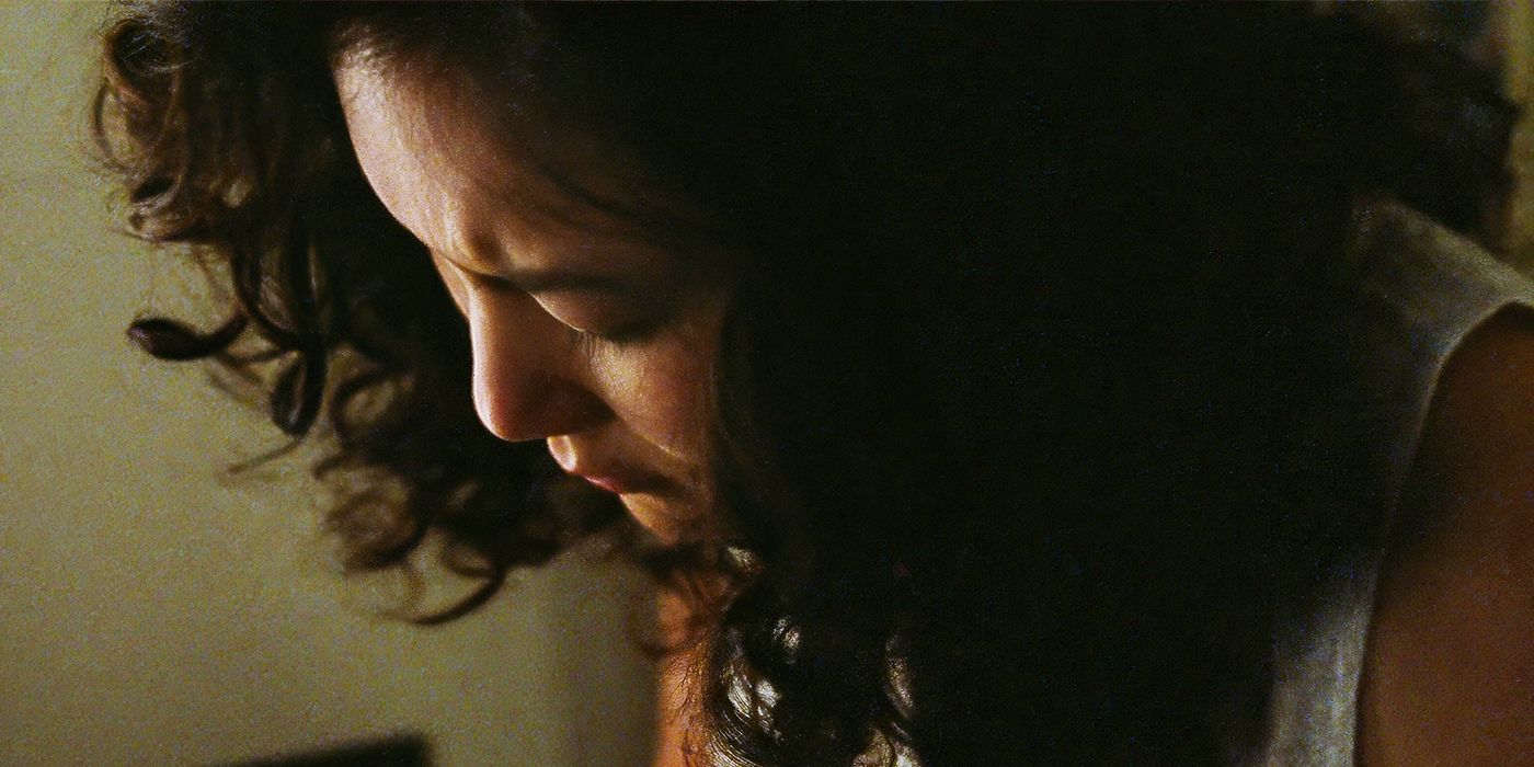 Ally Maki as Judith looking downcast in a room by herself in a stil from Seagrass.