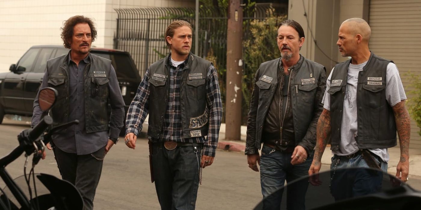 Tig (Kim Coates), Chibs (Tommy Flanagan), Jax (Charlie Hunnam), and Happy (David Labrava) walking through the street in Sons of Anarchy
