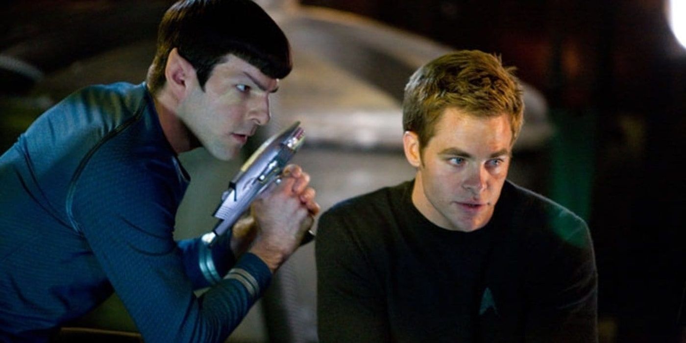 Zachary Quinto as Spock holding a Phaser beside Chris Pine as James T. Kirk in 2009's Star Trek