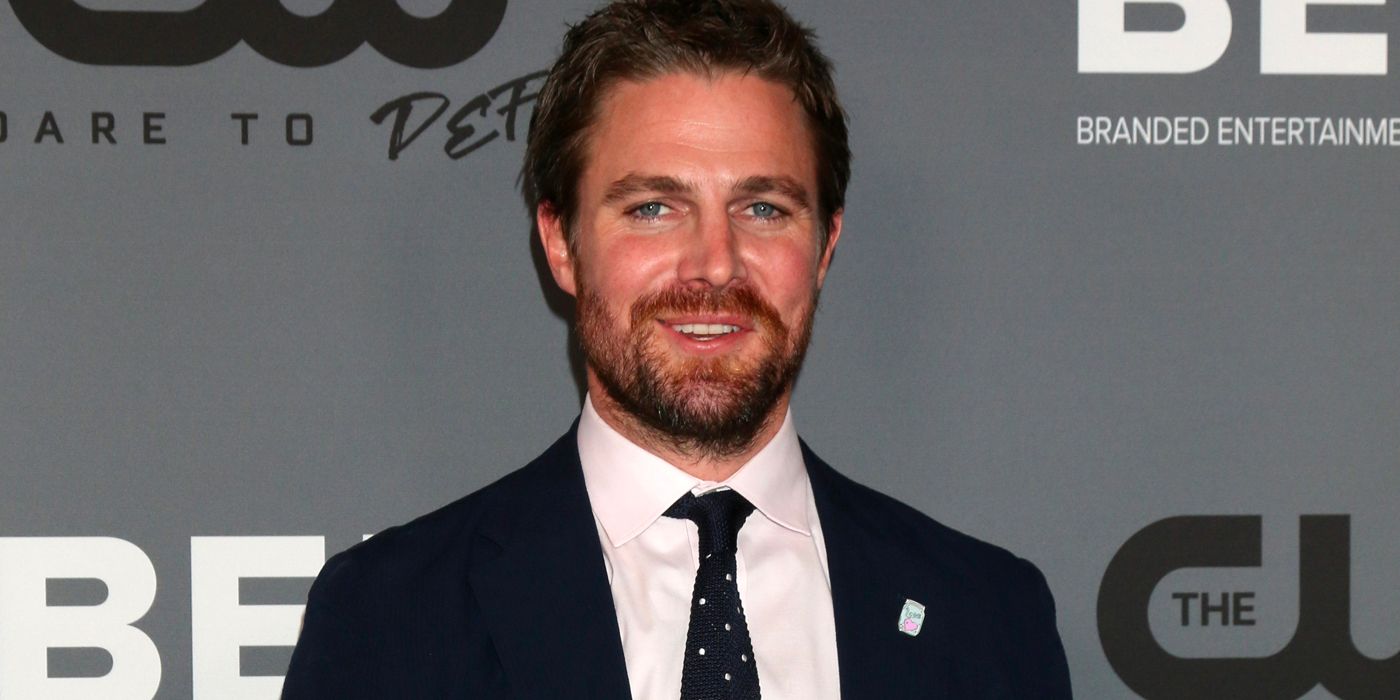 Stephen Amell on the red carpet at a CW event