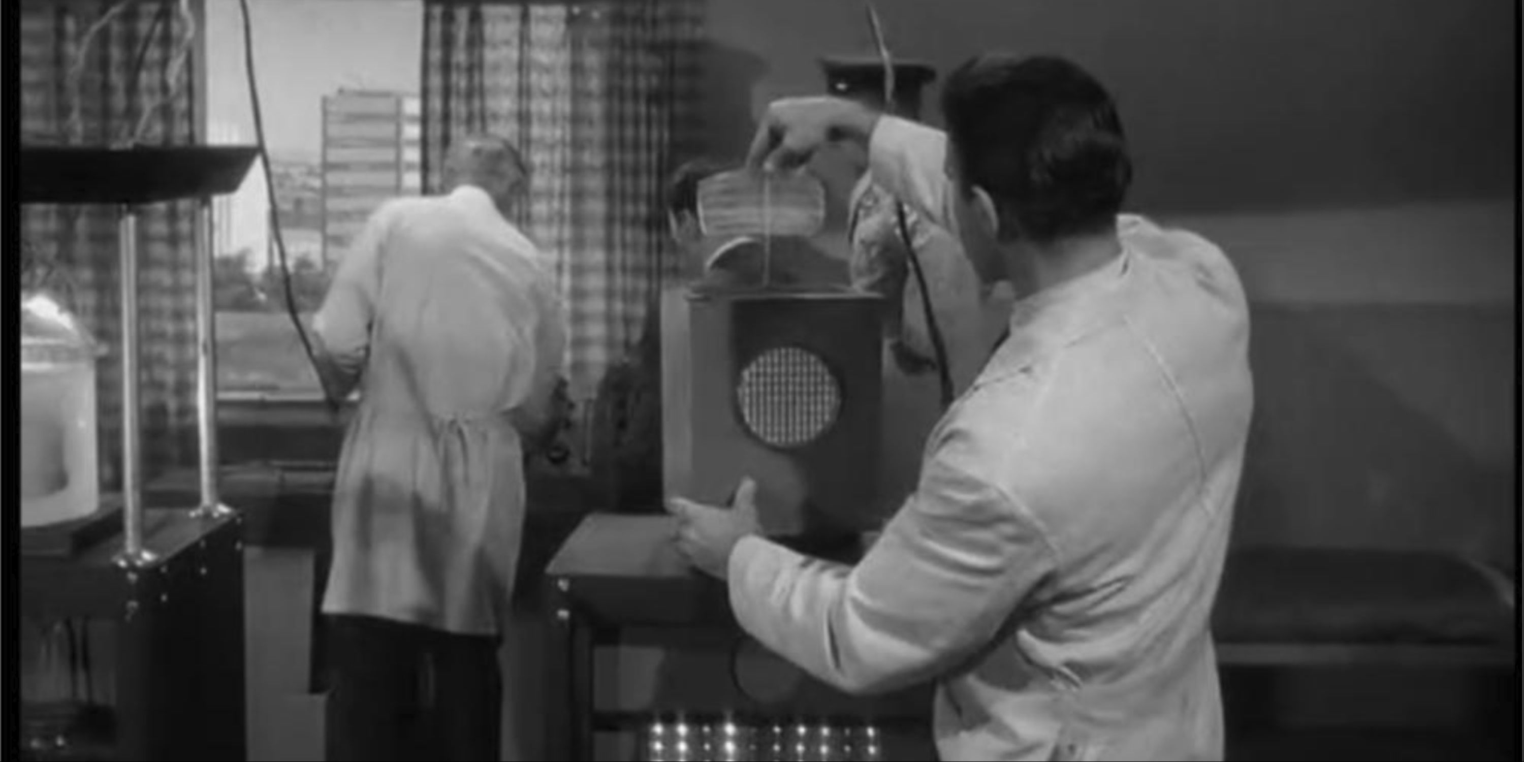 One man operates the machine while another plugs it into the outer limits.