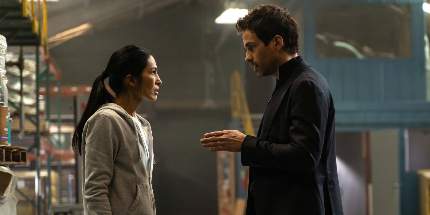 Elodie Yung and Santiago Carbrera as Thony and Jorge, talking in a warehouse in The Cleaning Lady Season 3.