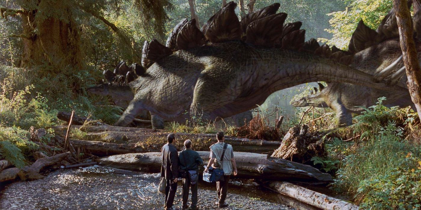 Three characters wathcing a large dinosaur in The Lost World Jurassic Park