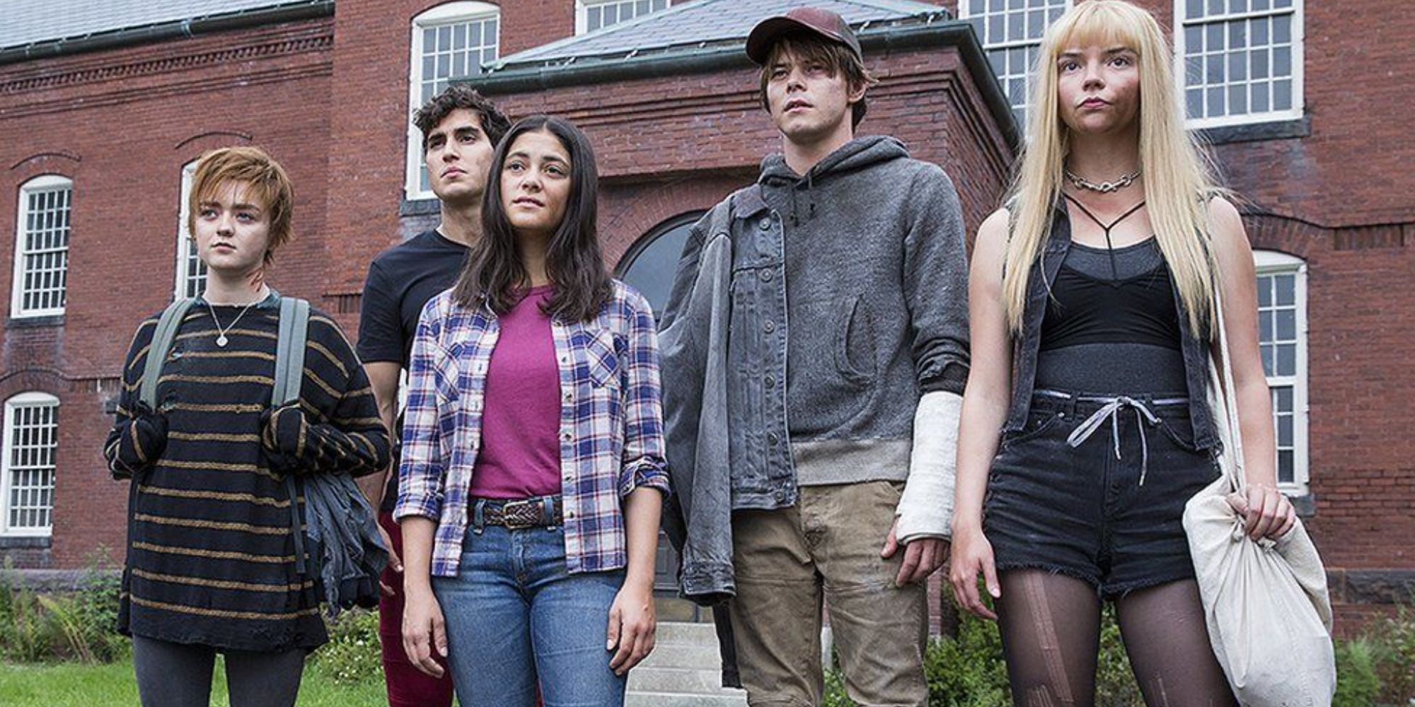 The cast of The New Mutants standing together outside their school