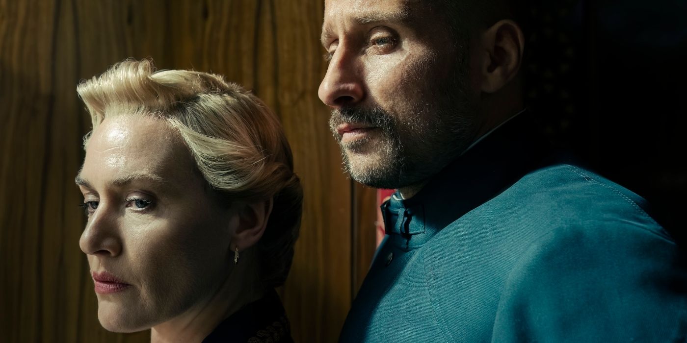 Kate Winslet and Matthias Schoenaerts cuddling in 'The Regime'