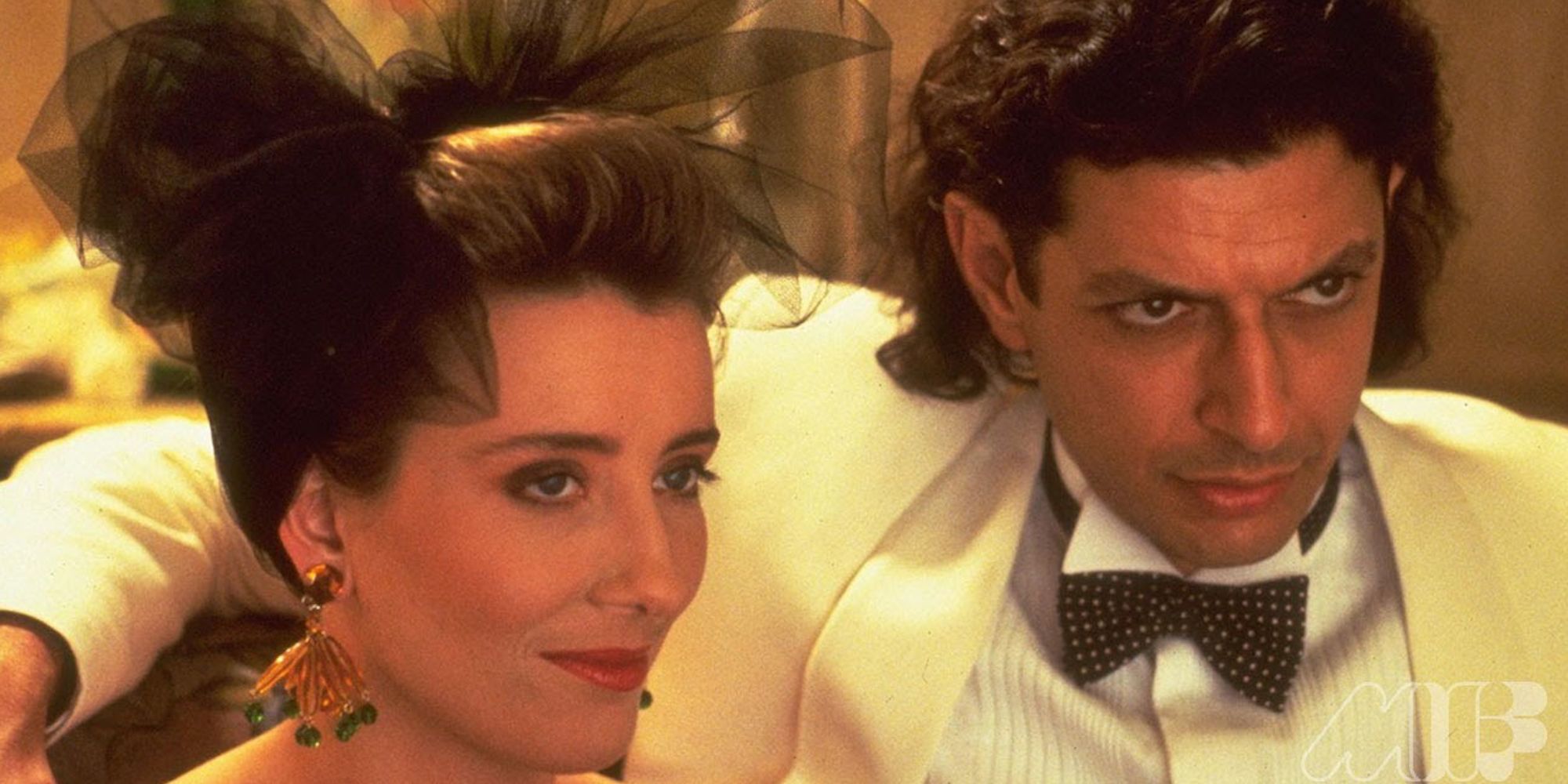 Jeff Goldblum as Dexter and Emma Thompson as Kate look serious off-screen in evening wear in The Tall Guy.