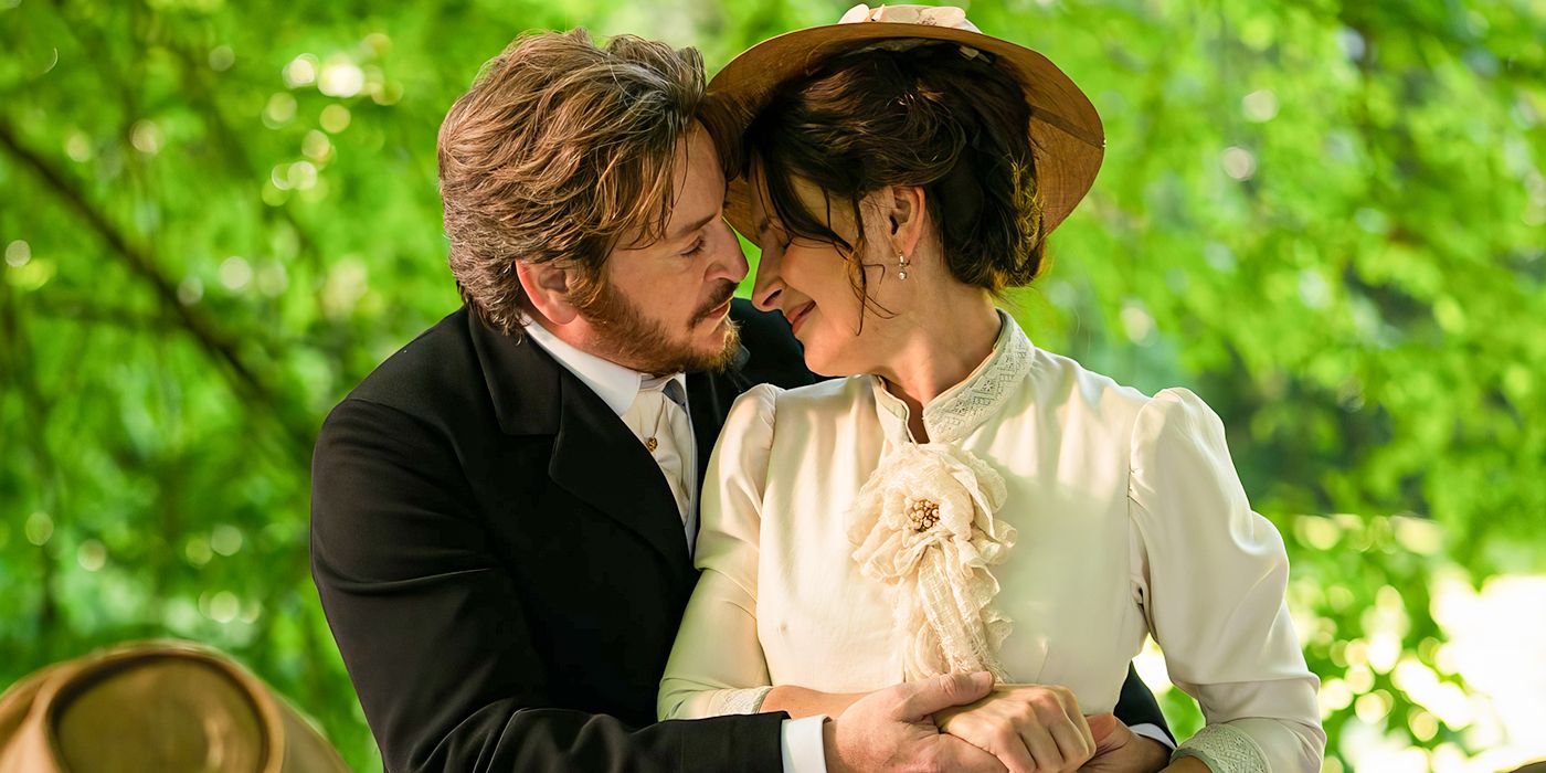 Benoît Magimel as Dodin and Juliette Binoche as Eugénie embracing following their wedding annoucement with a beautiful green tree as the backdrop in The Taste of Things. 
