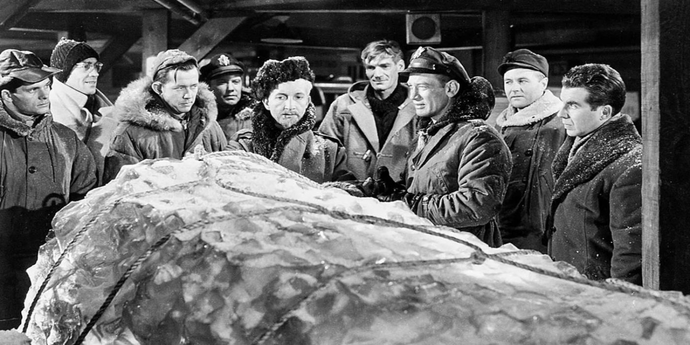 A black and white shot of the cast of The Thing from Another World.