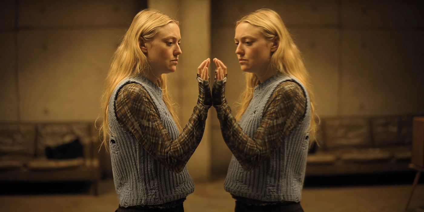 Dakota Fanning as Mina, tapping her reflection in The Watchers.