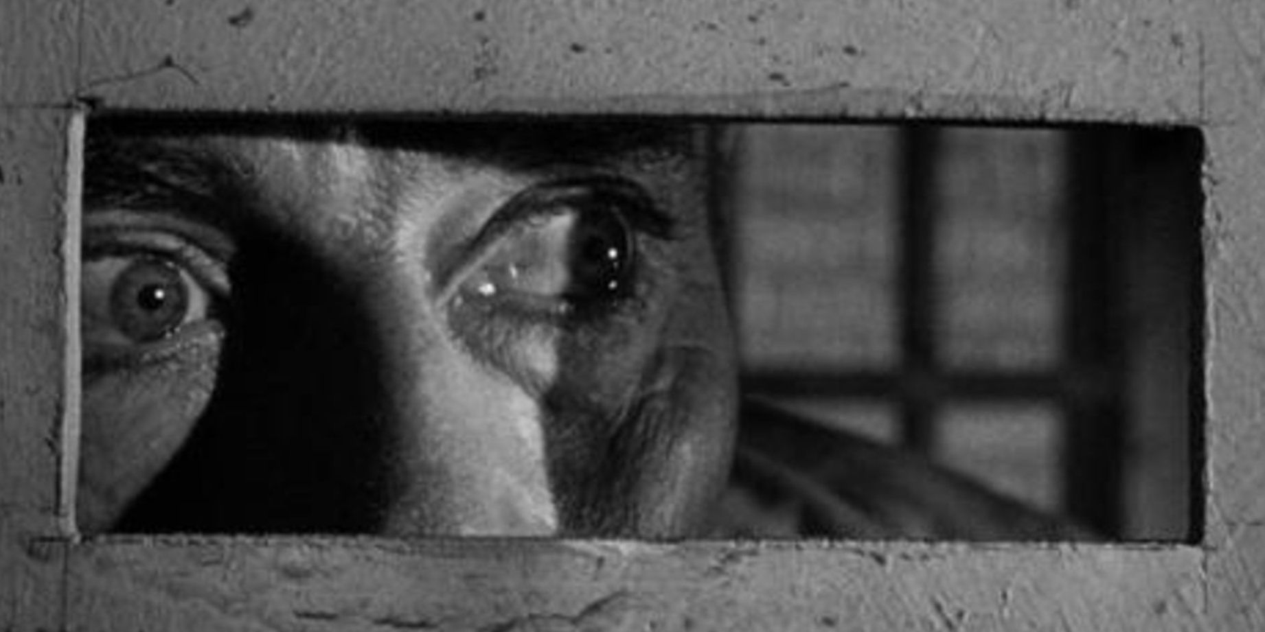Henry Fonda as Manny, looking through a prison door in 'The Wrong Man'