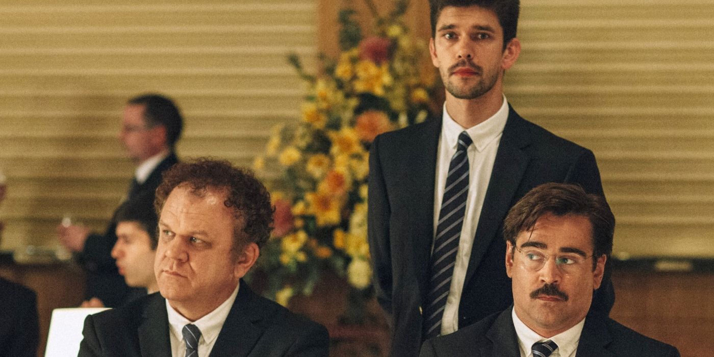 Colin Farrell, John C. Reilly, and Ben Whishaw as David, Robert, and John, wearing suits and looking unimpressed in The Lobster