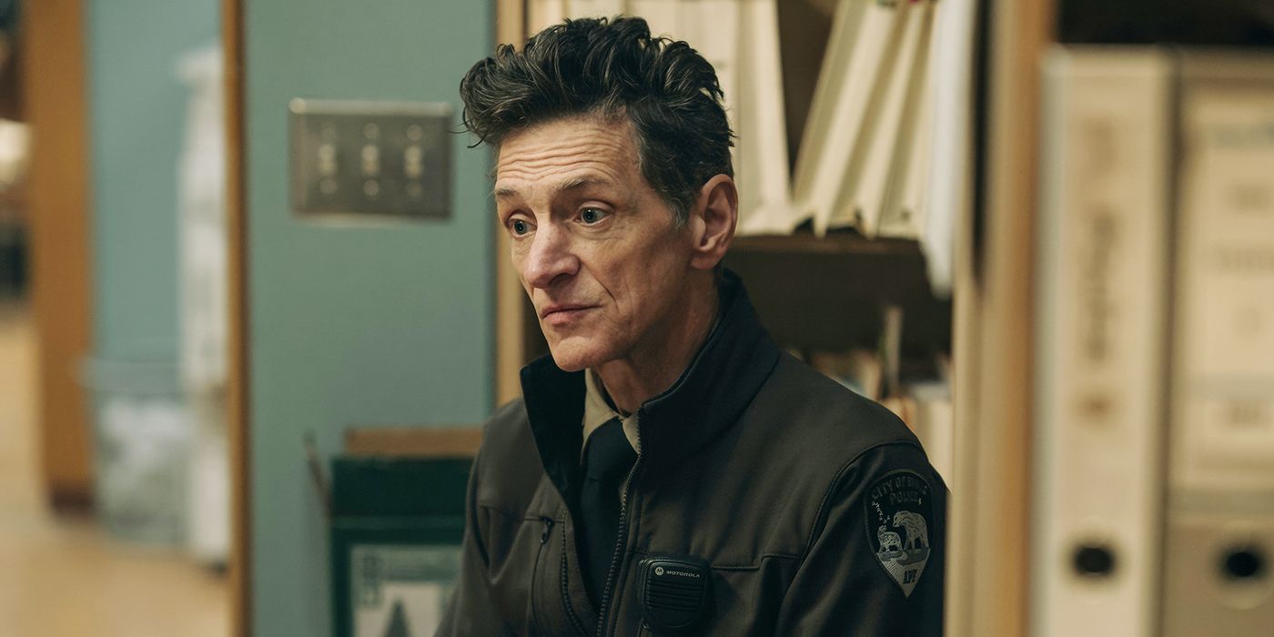John Hawkes as Hank Prior wearing his police uniform and looking at something off screen in True Detective: Night Country Episode 5. 
