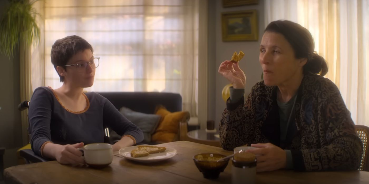 Julia Louis-Dreyfus and Lola Petticrew eating a meal as Zora and Tuesday