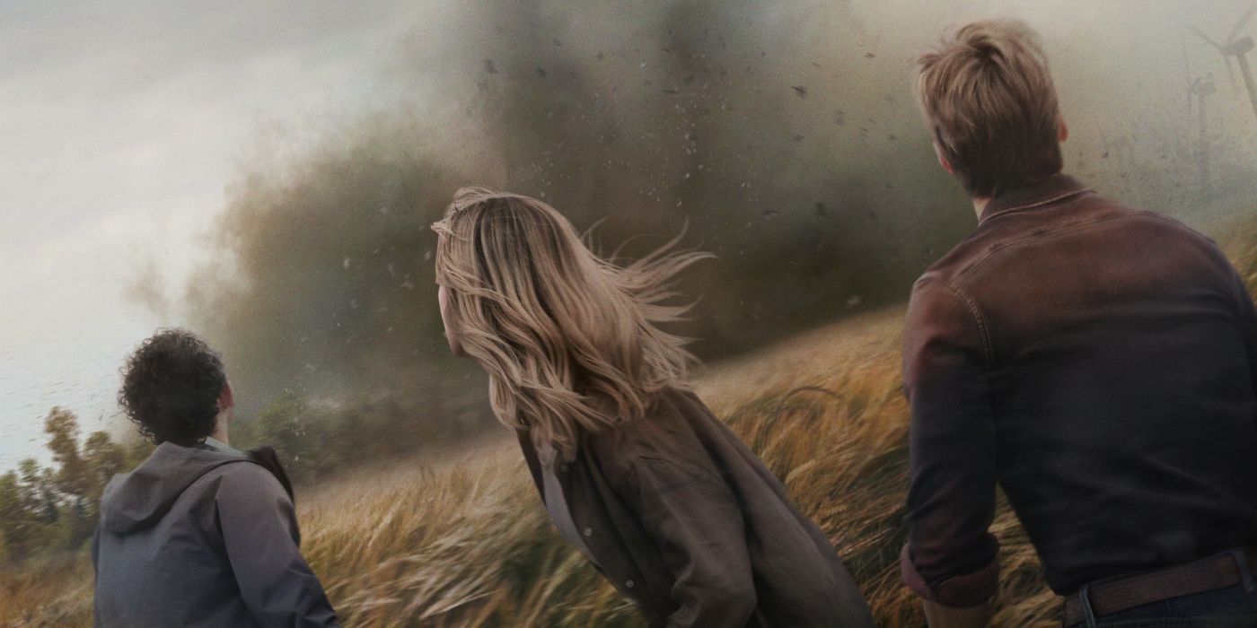 Anthony Ramos, Daisy Edgar-Jones, and Glen Powell as Javi, Kate, and Tyler, facing a tornado with their backs turned away from the camera on the poster for Twisters.