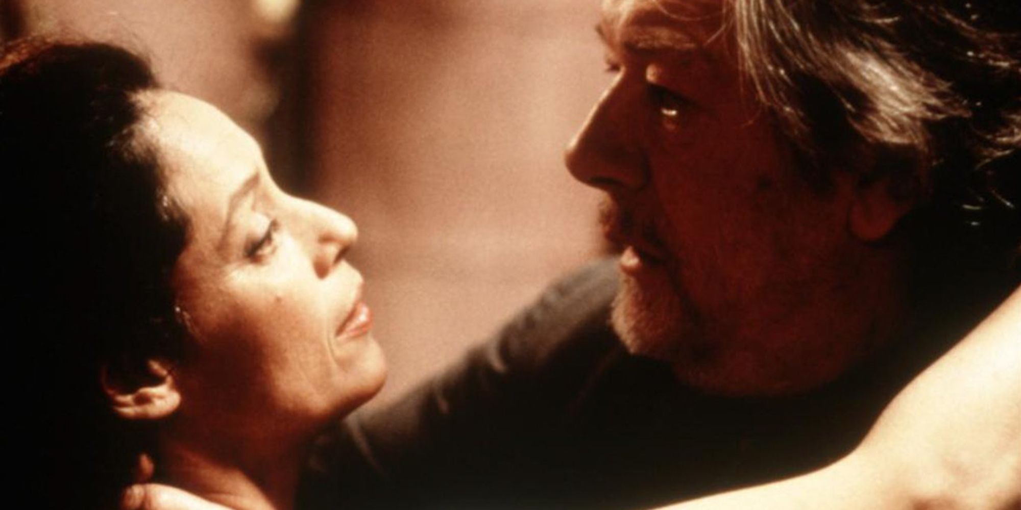 Michael Gambon and Sônia Braga embrace in Two Deaths.