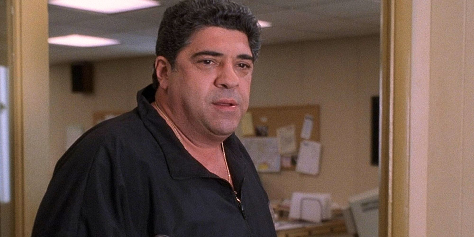 Vincent Pastore standing in a doorway in The Sopranos